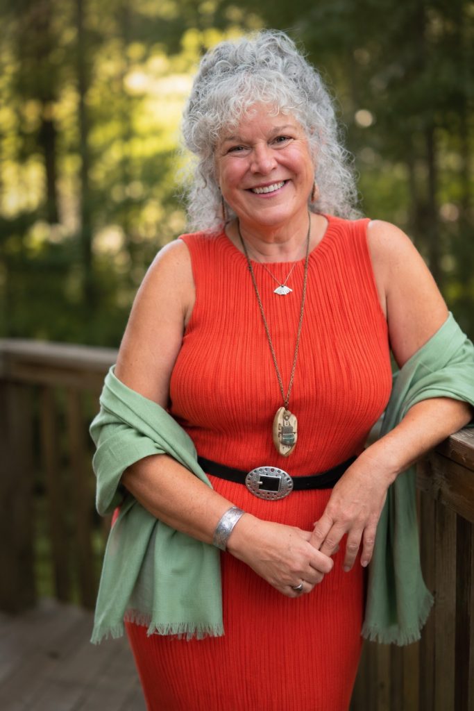 Susan Varga portrait wearing a terrain botanical perfume and custom artifact necklace